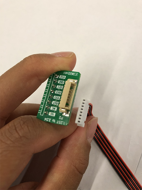 Small green board with cable